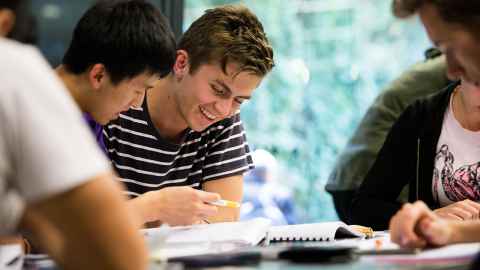 Students working at a table.