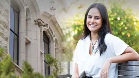 Smiling woman sitting outside