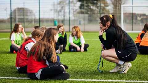 School children on a playing field