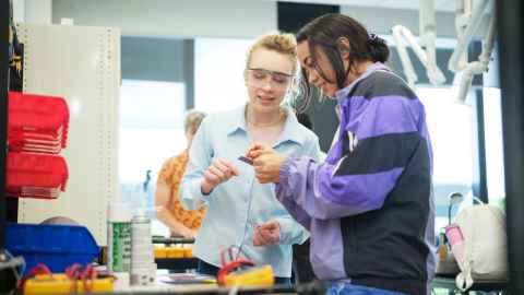 Engineering students working in lab