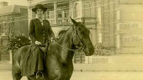 A photo of Dorothy Spragg on a horse in sepia tone. 