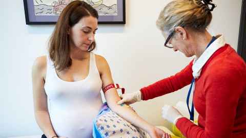 Pregnant mother participating in clinical trial