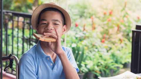 Boy eating a piece of bread