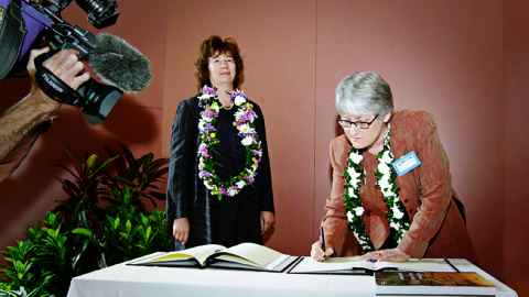 Deputy Vice Chancellor (Academic) Professor Raewyn Dalziel signing the transfer documents with Heather Yamasee from the FCO, 2002. Photograph: Godfrey Boehnke.