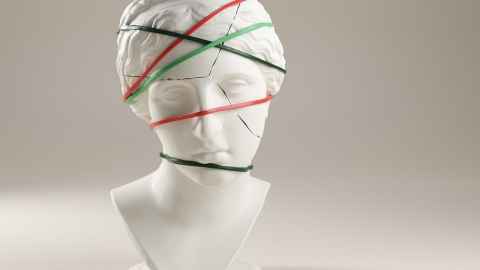Graphic of female face, head cracking wrapped in tape, suggesting distress 