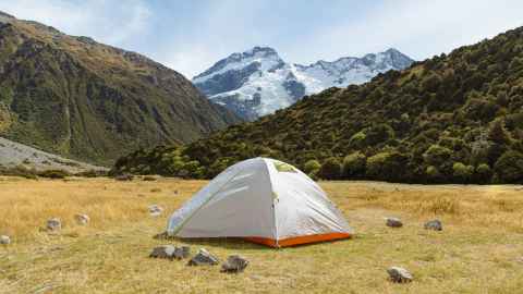 Small tent in foreground with Mt Cook in background