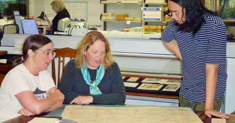 Professor Maartje Abbenhuis (left) with guest curators Catriona McCallum (centre) and Tanlin Liu (right) in the Special Collections Reading Room