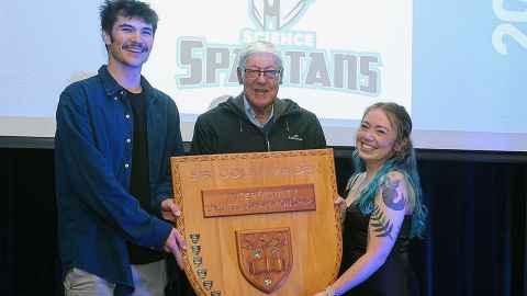 Sir Colin at the Sir Colin Maiden Interfaculty Sports Championships in 2022 holding the trophy in his name.