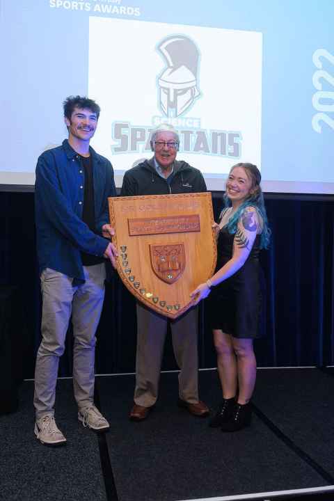 Presenting the trophy to the Science Spartans at the sports awards in 2022. With Science sports leaders, Kellen Dudley-Rode and Wallis Bland.