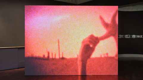 Large screen projecting Derek Jarman's short film 'My Very Beautiful Movie,' 1974. 