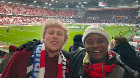 Jack attends an SC Freiburg football match with his neighbour and close friend, Parrendah.