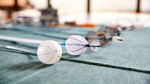 Various endoscopes lie on a table, showing what they look like inflated and deflated