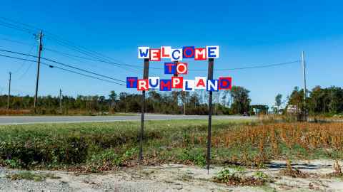 Sign oomprised of individual letters, red, white and blue, spelling Welcome to Trumpland
