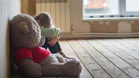 child and teddy istock