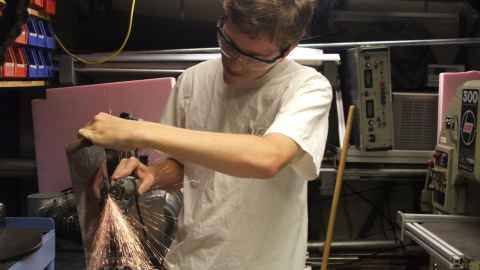 A much-younger Bryan welding with lots of sparks coming out and not that much safety equipment!