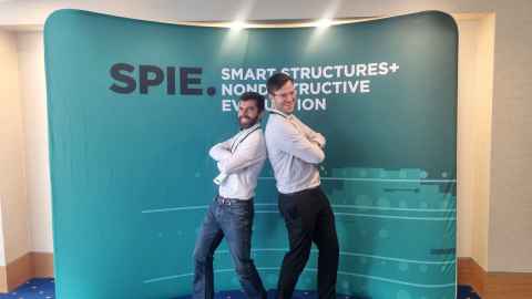 Arne and Robin posing in front of the SPIE sign