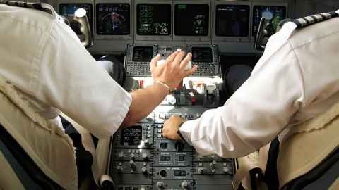 Pilot and copilot in an aeroplane cockpit