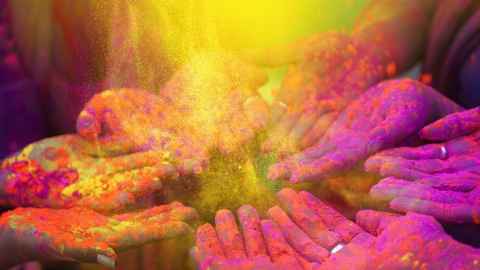 image of hands covered in coloured dust