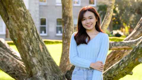 Smiling woman standing outdoors