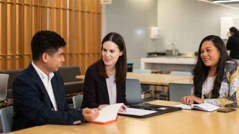 people talking at a table
