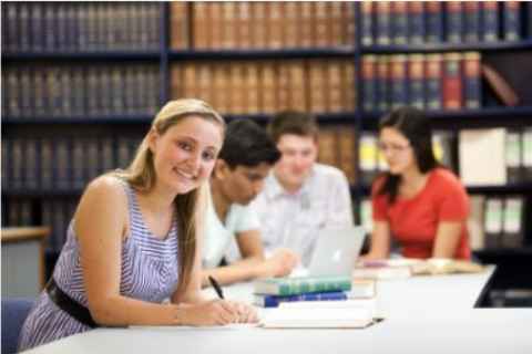 student in library